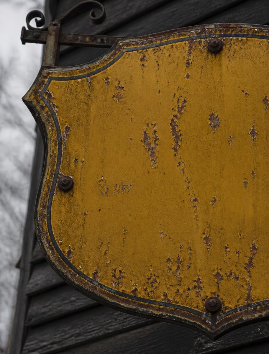 The aged yellow sign